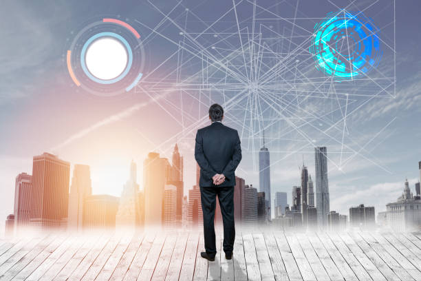 istock Businessman looking at cogwheels against city background 1012110322