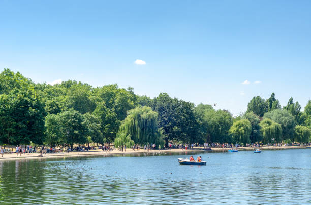 Weekend fun at the Serpentine Lake in Hyde Park, London Photo taken during the summer heatwave of 2018 - the hottest in the country since 1976. hyde park london photos stock pictures, royalty-free photos & images