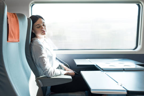 istock Young Girl Sleeping On A Train in Italy 1012133304