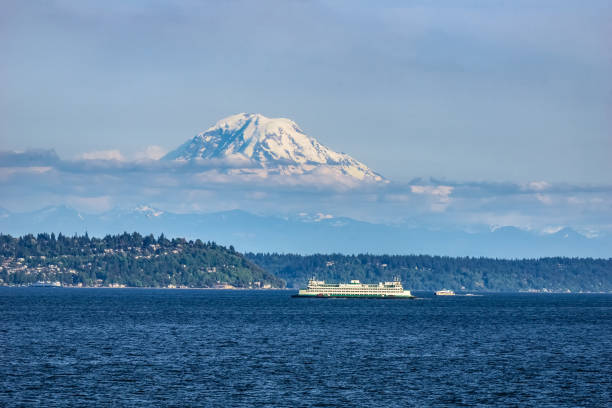Mt Rainier from the Puget Sound, WA The Puget Sound with Mount Rainier above Seattle in the background, Washington state, USA. mt rainier stock pictures, royalty-free photos & images