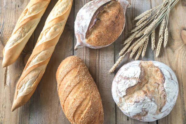 istock Different kinds of bread on the wooden background 1012145056