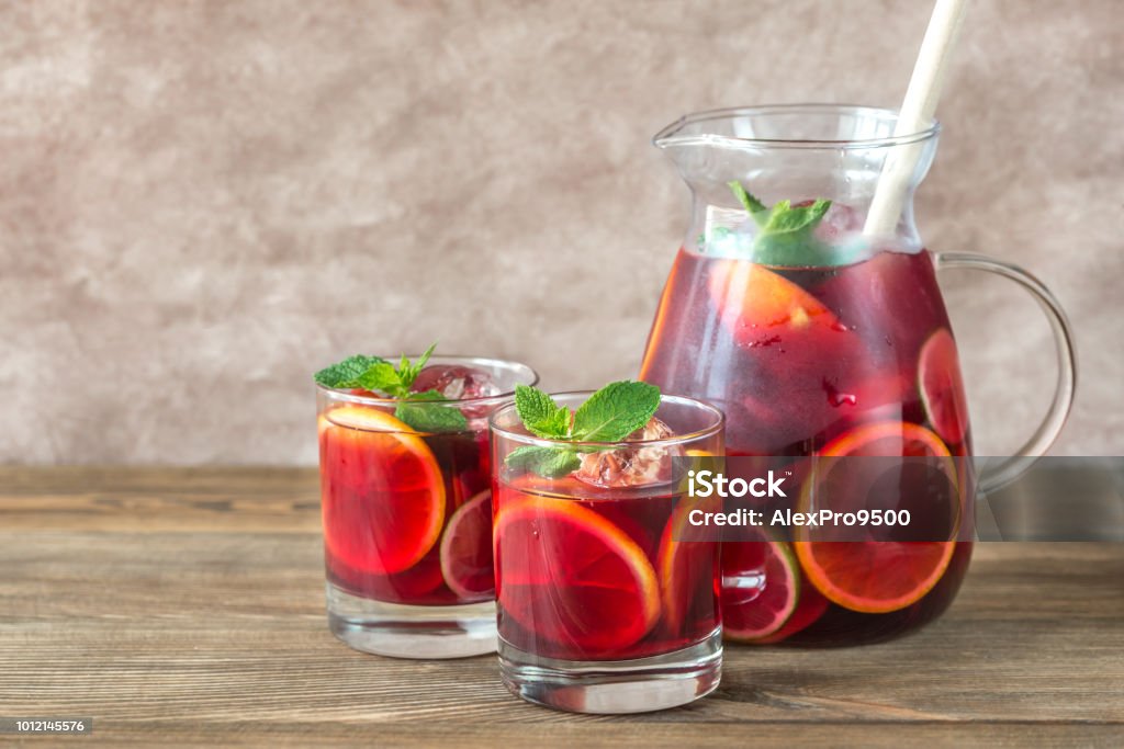 A pitcher and two glasses with Spanish fruit Sangria Sangria Stock Photo
