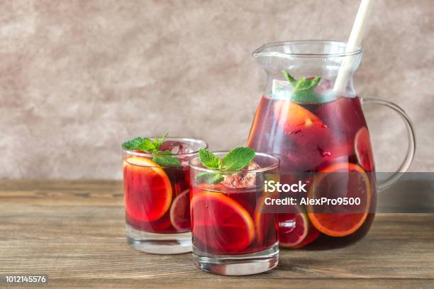 A Pitcher And Two Glasses With Spanish Fruit Sangria Stock Photo - Download Image Now