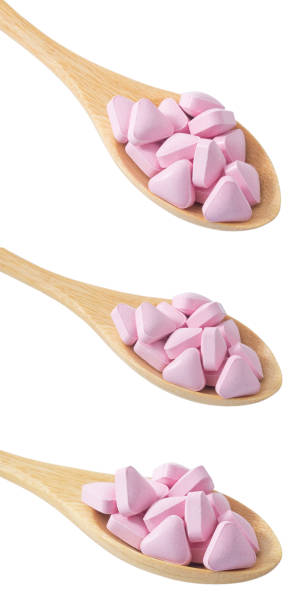 istock Wooden Spoons Full with Vitamins on White 1012151002