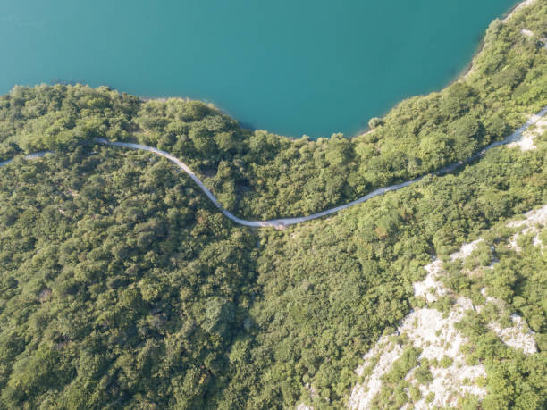 istock Road next to lake Molveno in the Dolomites 1012154762