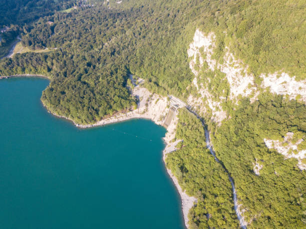 istock Molveno lake with mountains and forest 1012154822
