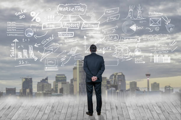 istock Businessman looking at hand written business plan 1012158012