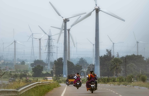 India, Madurai-Rameshwaram rd, November 24, 2014: Highway and wind turbines in Tamil Nadu,  India