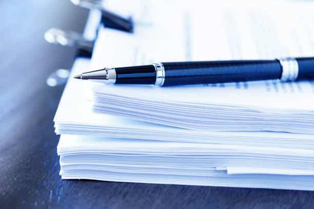 istock Ballpoint Pen Resting On Top Of Stack Of Documents 1012160602