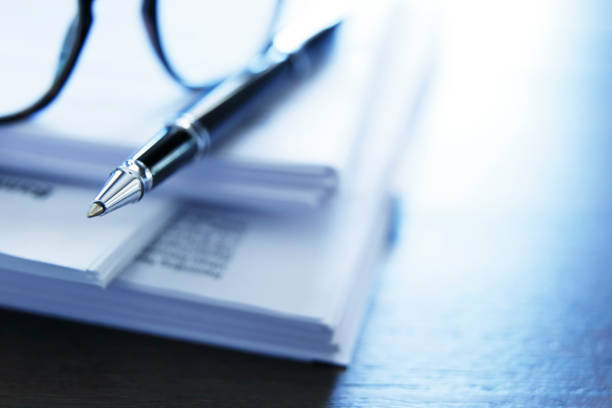 istock Ballpoint Pen Resting On Top Of Stack Of Documents 1012160644
