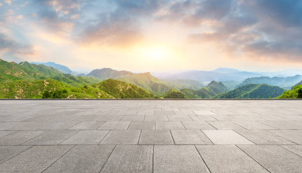 istock Clean square floor and mountain natural landscape at sunrise 1012180828