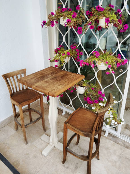 istock Outdoor cafe chairs and table 1012185610