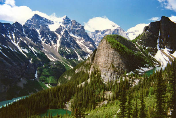 istock Mountains surrounding blue Lake Louise from above 1012193608