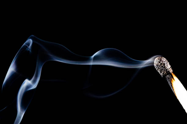 istock Smoke Swirling from Burnt Wooden Matchstick 1012195194