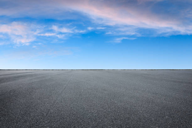 istock Empty asphalt square and beautiful colorful sky clouds 1012200284