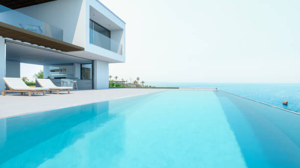 villa vacanze di lusso con piscina a sfioro - swimming pool luxury mansion holiday villa foto e immagini stock