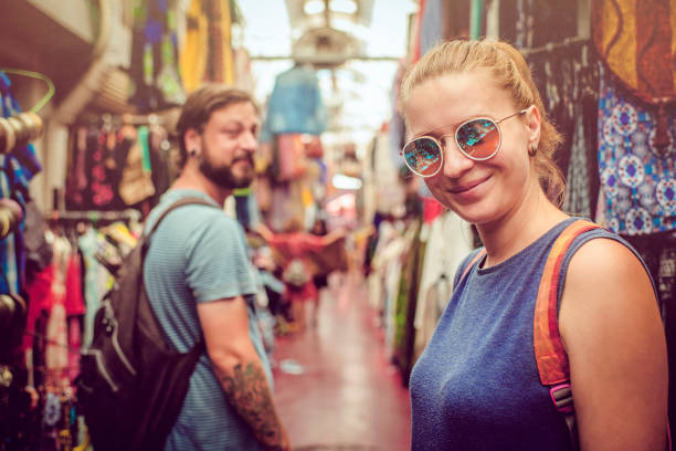 istock Couple discover souvenirs market while travelling 1012202598