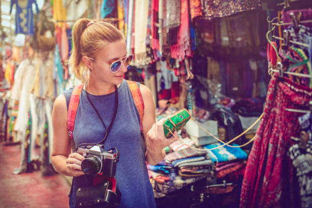Couple discover souvenirs market while travelling