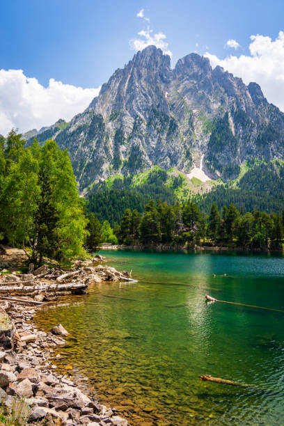 Twin Peaks Els Encantats and Sant Maurici's Lake in summer.