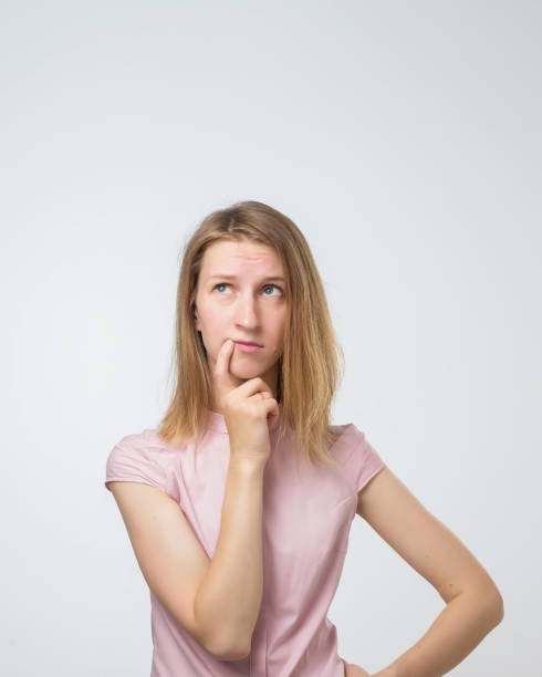 istock young pensive caucasian woman over white background 1012211052