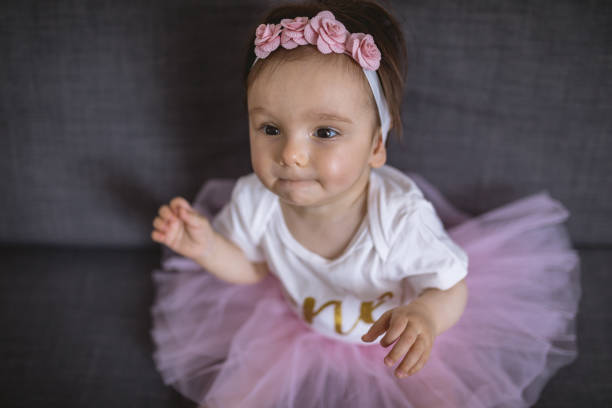 istock Blushing little child in a ballet dress 1012230080