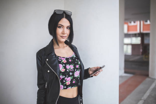 istock Pretty woman posing on a parking lot. 1012230098