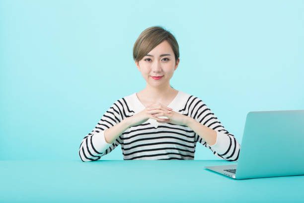 istock Young woman clasping hands with happy face 1012260104