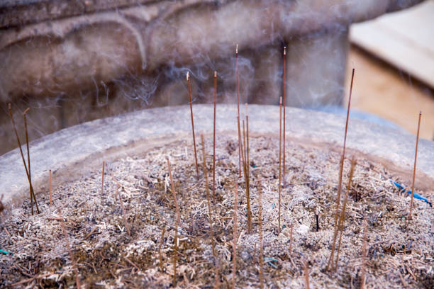 istock incense stick burned in a pot of sand, buddhism pray 1012289740