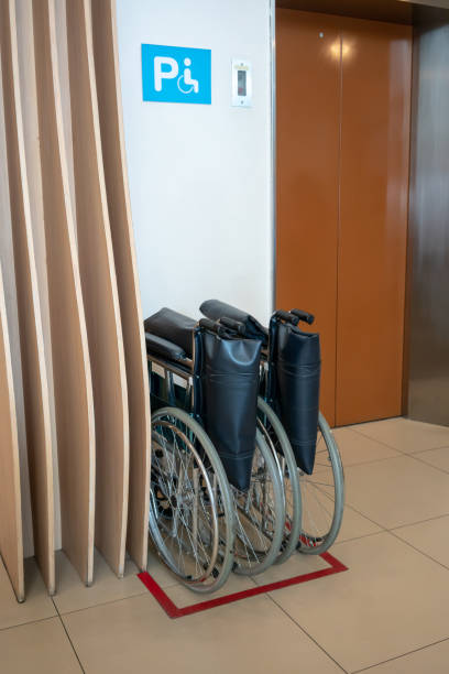 istock Wheelchair and elevator for disabled, wheelchair waiting in front of elevator in building 1012289936