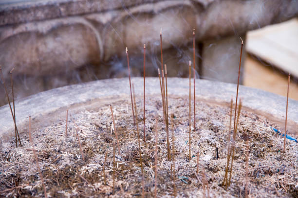 incense stick burned in a pot of sand, buddhism pray