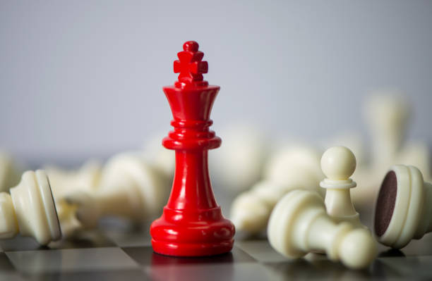 istock Red chess between white chess board game for competition and strategy, business success concept 1012309600