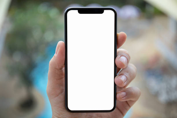istock man hand holding phone with isolated screen background pool 1012312882