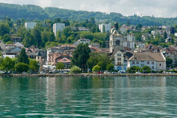 Lake Geneva shoreline at Evian-les-Bains Lakefront as you approach Evian on the ferry from Lausanne evian les bains stock pictures, royalty-free photos & images