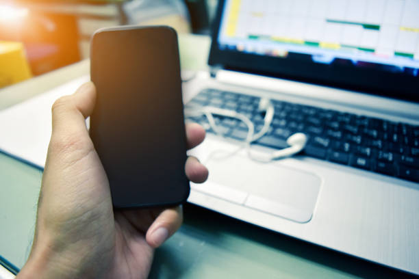 istock Hand holding smartphone,People using smartphone to shopping online by internet 1012321546