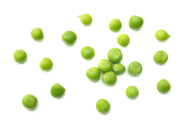 istock fresh green peas isolated on a white background. top view 1012324090