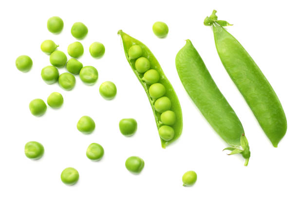 istock fresh green peas isolated on a white background. top view 1012324096