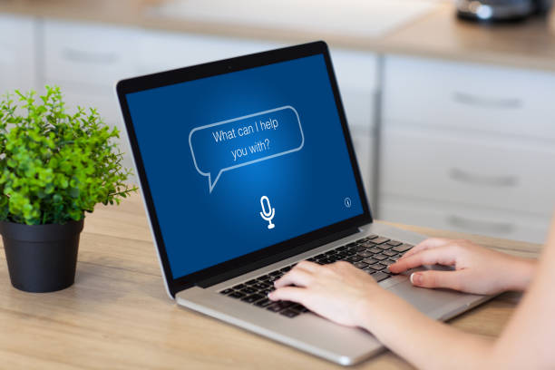 istock woman hands laptop with app personal assistant screen in room 1012324102