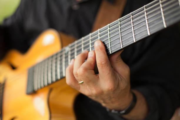 istock Detail of guitarist playing seven string guitar 1012328716