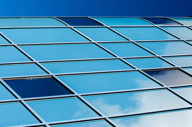 istock Stained glass windows large windows. Wall of glass. a hard, brittle substance usually transparent or translucent made by fusing sand with soda lime and sometimes other ingredients and cooling rapidly 1012336992