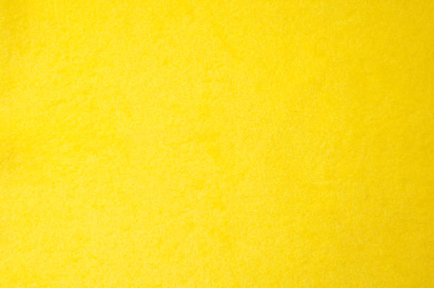 istock Texture background pattern. Woolen yellow fabric, cloth for a blanket, outer clothing.  Closeup horizontal fragment 1012337016
