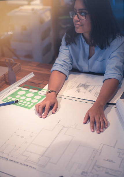 istock Young latin woman in design office working 1012348280