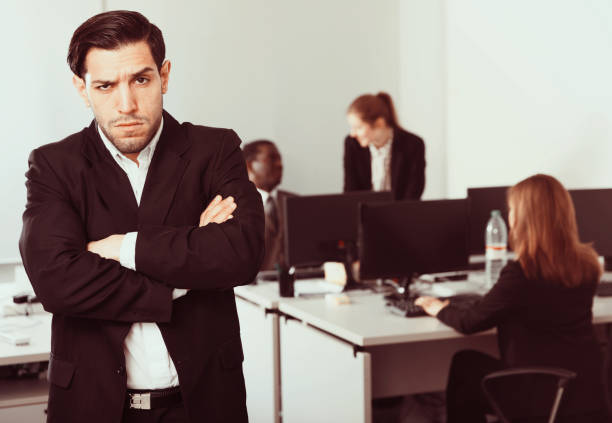 istock Young businessman standing in office on backround with colleague 1012354342