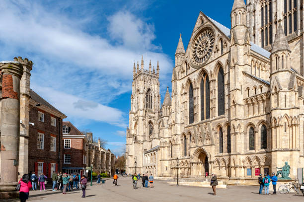 york minster, the historic cathedral built in english gothic architectural style and major tourist landmark of the city of york in england, uk - york england england minster middle ages imagens e fotografias de stock
