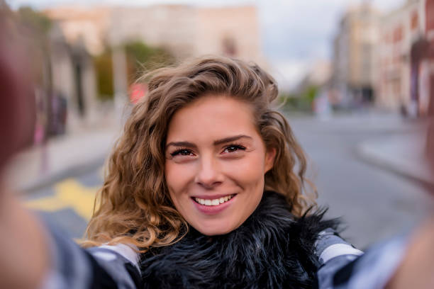 istock Young Woman Making a Self Portrait 1012363516
