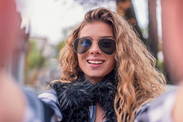 istock Young Woman Making a Self Portrait 1012363562