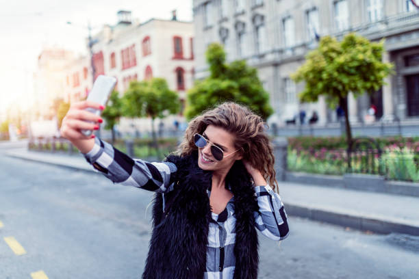 istock Young Woman Making a Self Portrait 1012363600