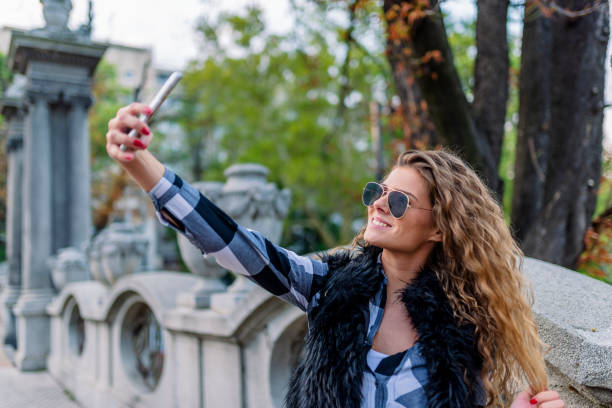 istock Young Woman Making a Self Portrait 1012363614