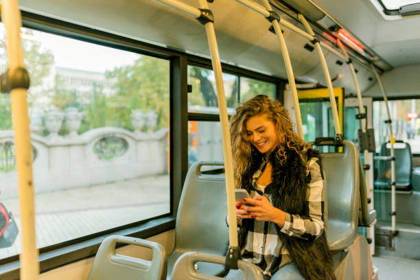 istock Woman with Smart Phone in the Bus 1012363624