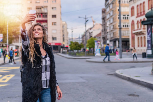 istock Young Woman Making a Self Portrait 1012363670