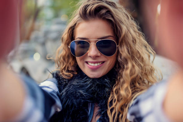 istock Young Woman Making a Self Portrait 1012363722